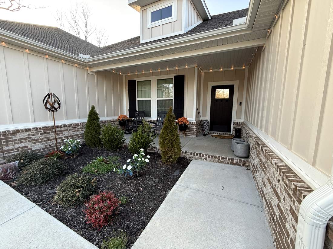 Front entry with brick walkway and landscaping